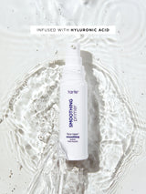 Tarte smoothing primer bottle with hyluronic acid text on a white background