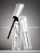 A shiny silver mascara tube labeled tarte lights, camera, LASHES platinum with a brush applicator exposed. It's accompanied by a travel-sized version, both on a reflective surface. Text: full-size, travel-size.