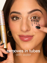 Woman applying makeup remover to her face with text tartelette tubing XL mascara 'removes in tubes with water'.