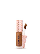 Tarte Shape Tape Radiant concealer with applicator on a white background