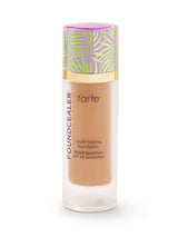 Tarte foundation bottle with leaf-patterned cap on a white background