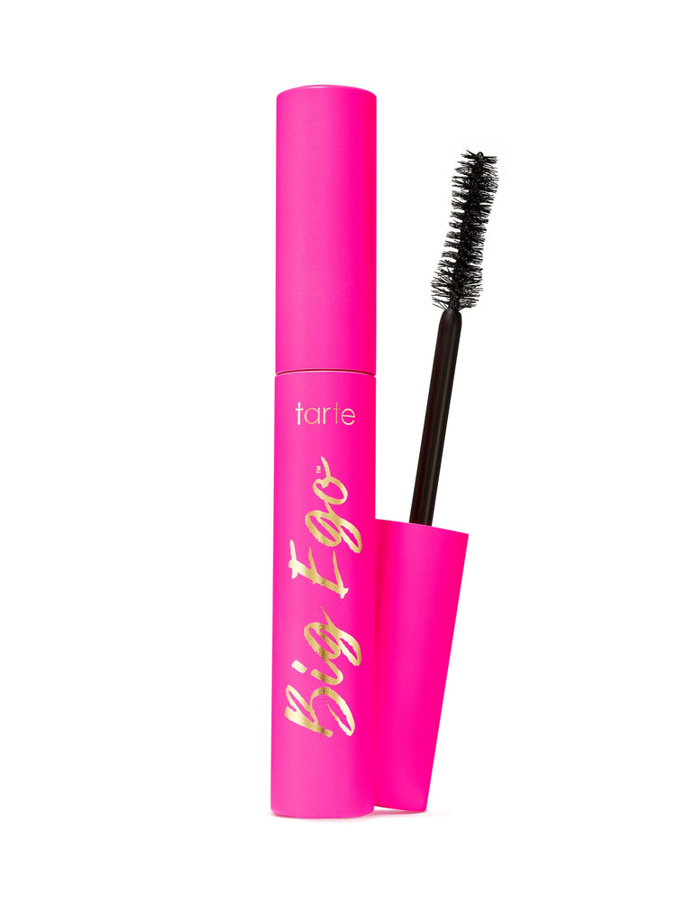 Pink mascara with black brush on a white background