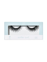 Eyelash packaging with 'surfer curl' text on a white background