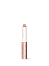 Lip balm stick with a white cap on a white background