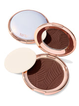 Compact powder with a zebra pattern in a rose gold case on a white background